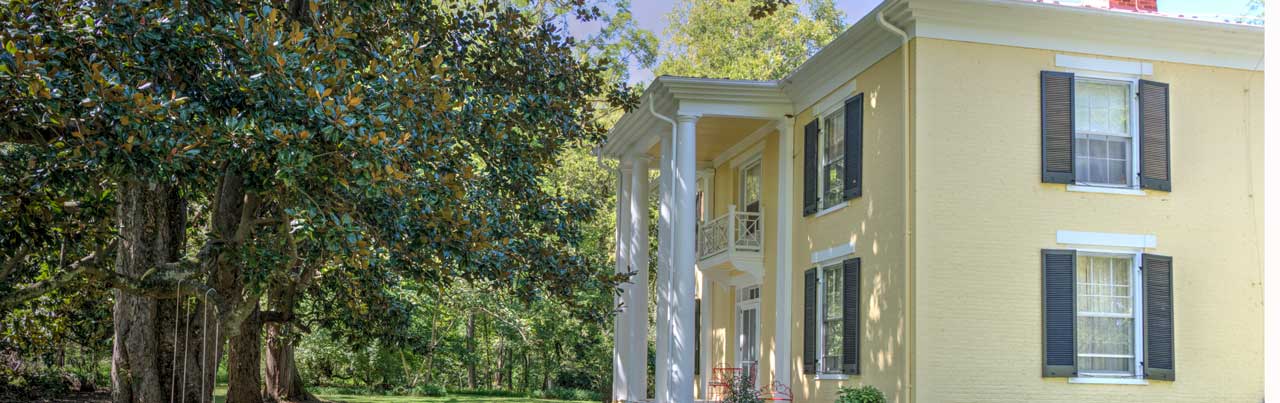 Historic c.1845 Mickle Knox estate with brick exterior and two-story columned porch